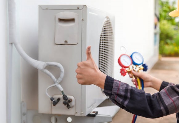 AC technician servicing an AC